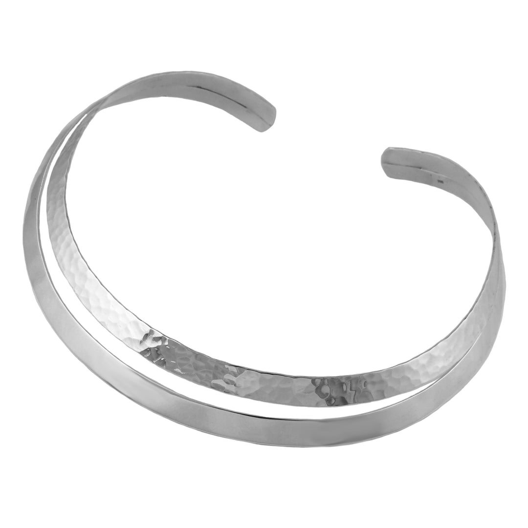 Silver choker necklace with a textured finish on a white background