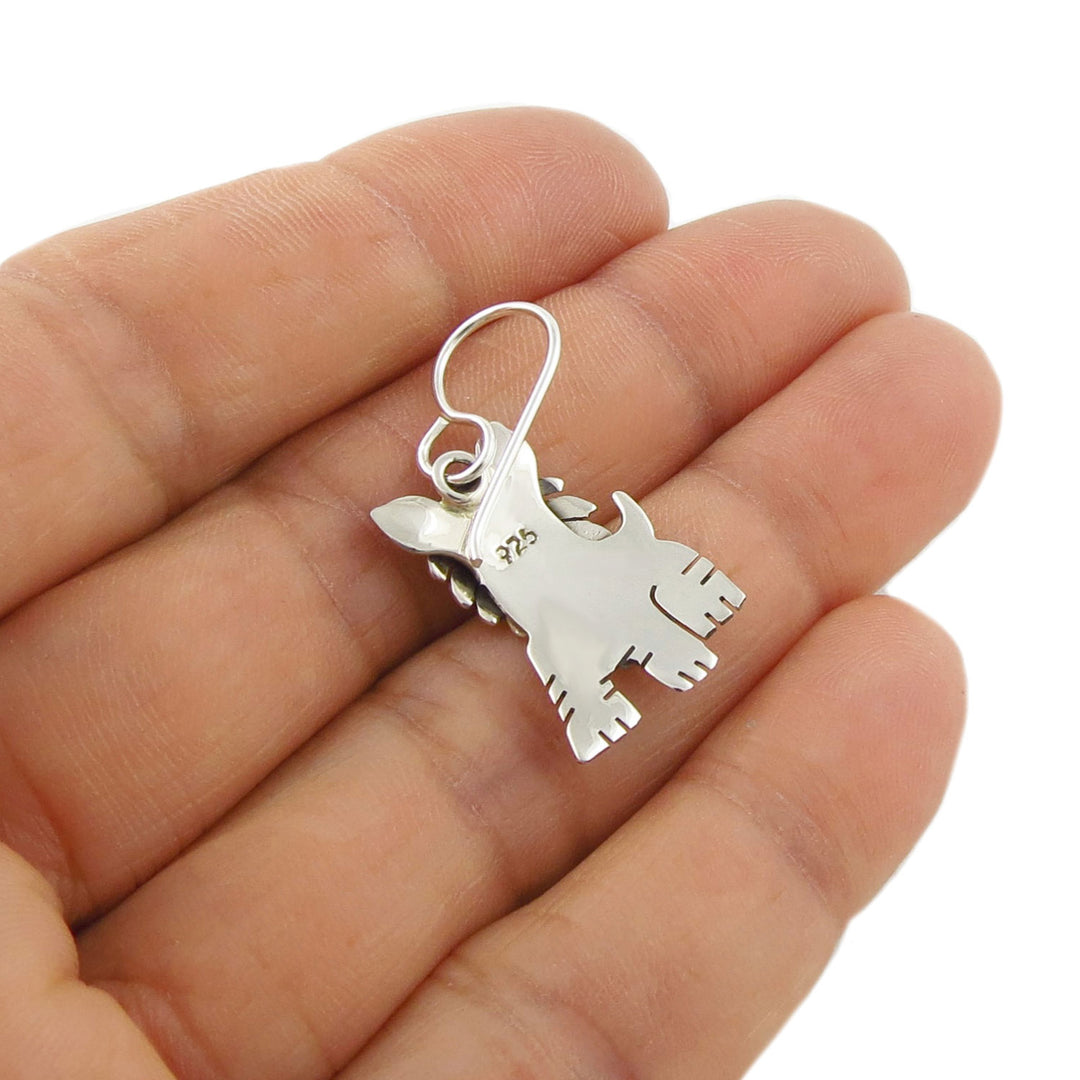 Reverse of a terrier dog shaped earring in 925 silver showing the 925 halllmark and hook fastener