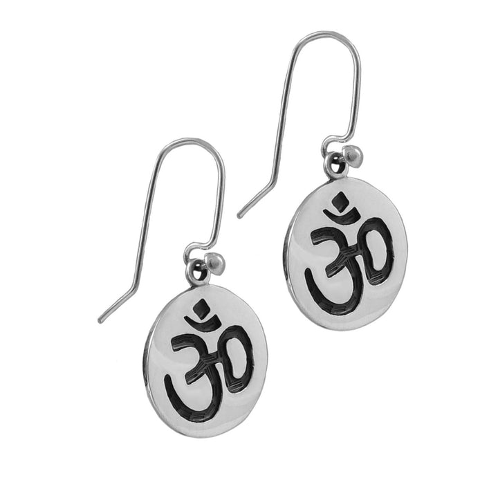 Pair of handmade 925 sterling silver earrings with Om symbol on a white background