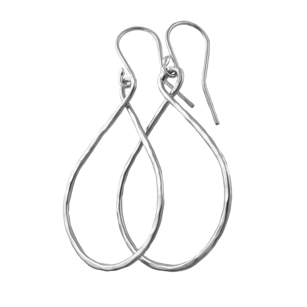 Pair of wide teardrop 925 silver earrings with a hammered finish on a white background