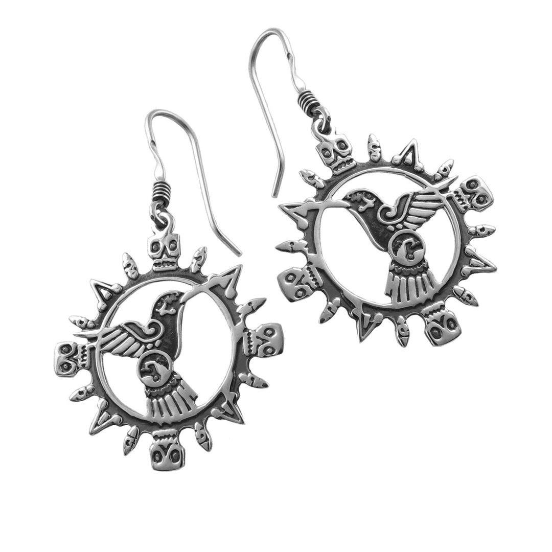 Pair of Mexican Aztec symbol skull & hummingbird 925 silver earrings with intricate designs on a white background