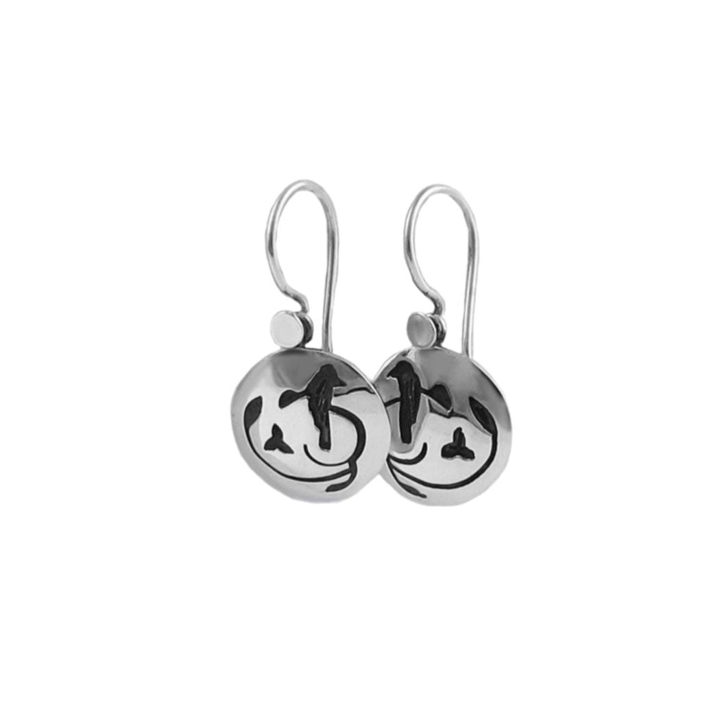 925 silver earrings featuring black nightingale silhouettes on hook fasteners on a white background