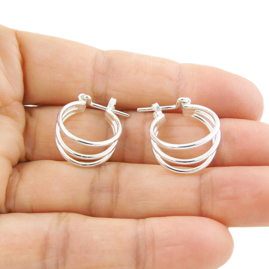 Handmade 925 sterling silver triple illusion hoop earrings for women on a white background