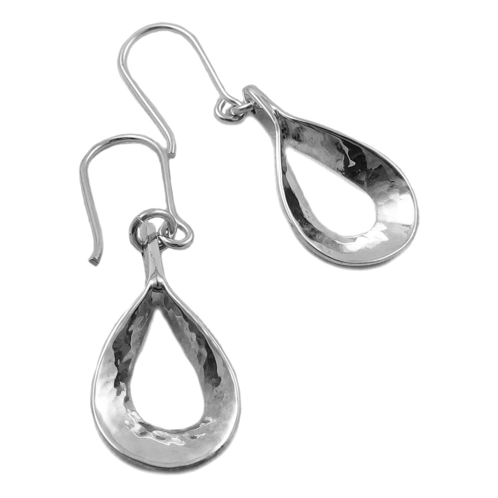 A pair of teardrop shaped earrings in sterling 925 silver with a hammered finish on a white background. 