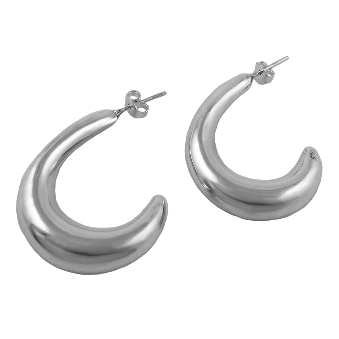 Handmade Mexican sterling 925 silver sculpted half hoop earrings on a white background