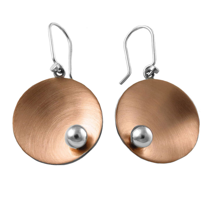 Pair of mixed metal 925 sterling silver and copper disc earrings with silver ball bead accents on a white background