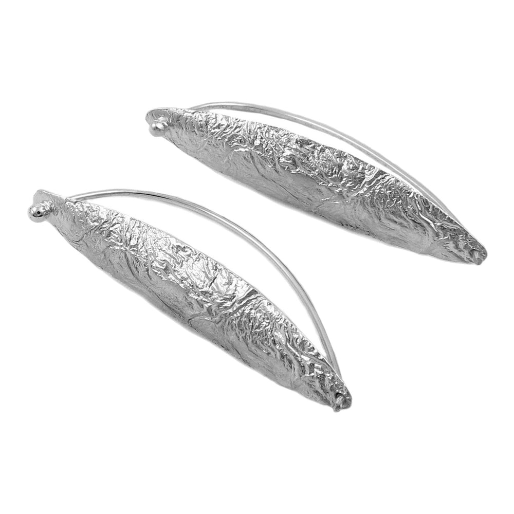 A pair of long crumpled Mexican 925 sterling silver threader earrings on a white background. 