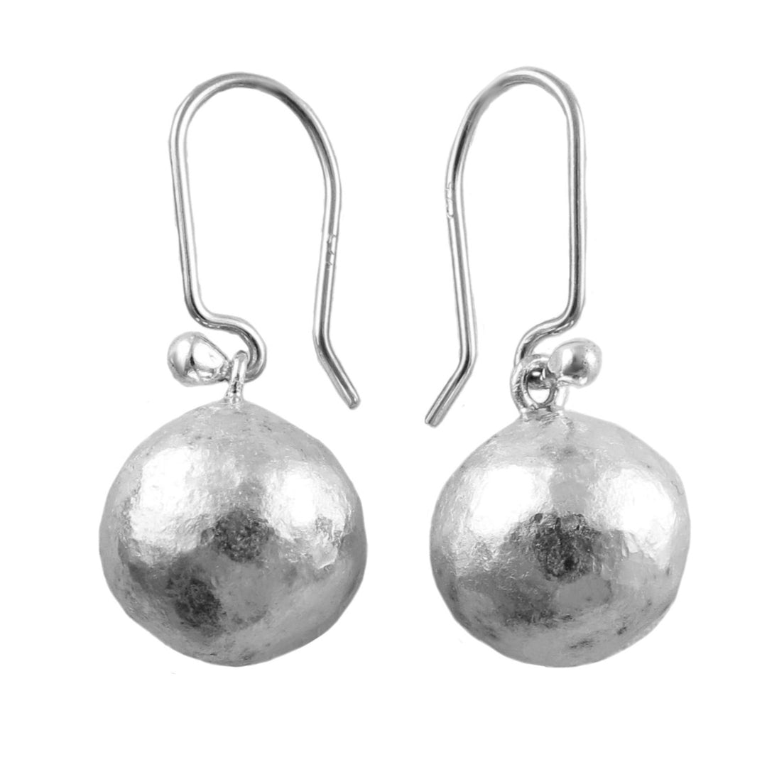 Pair of battered brutalist matt silver ball earrings on a white background