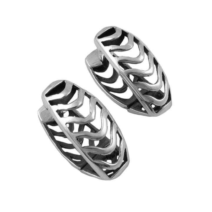 A pair of sterling 925 silver huggie clip-on hoop earrings with an openwork wavy chevron pattern, displayed on a clean white background.