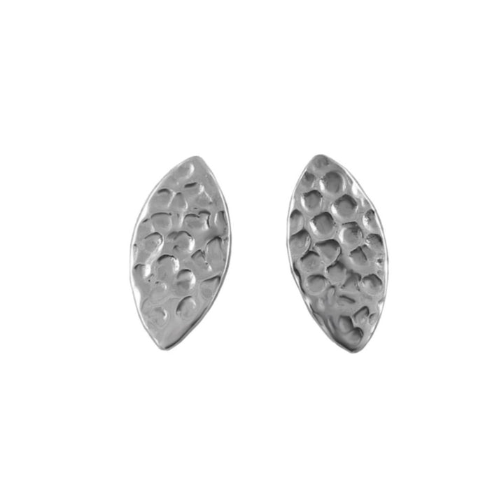 Sterling silver stud earrings in an elliptical shape with a textured hammered finish on a white background. 