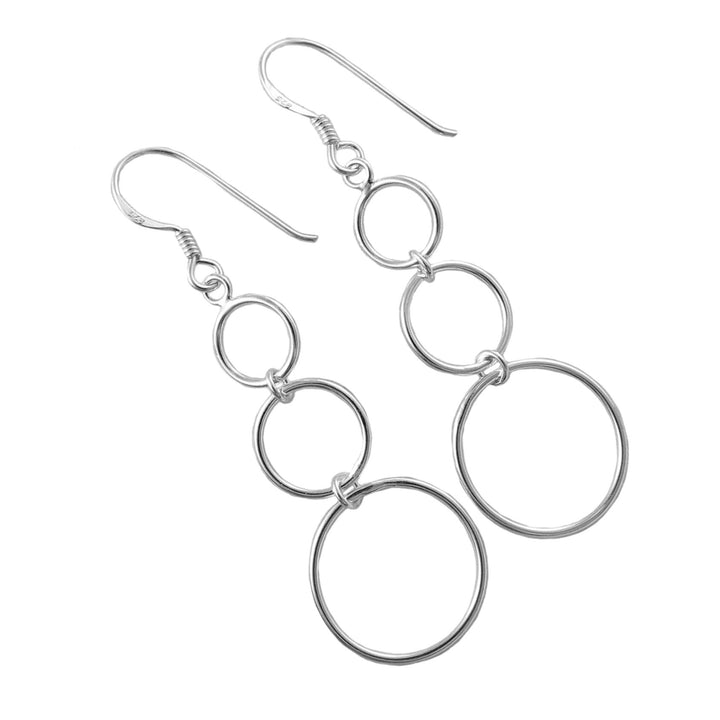 Sterling 925 Silver long triple circle earrings on a white background