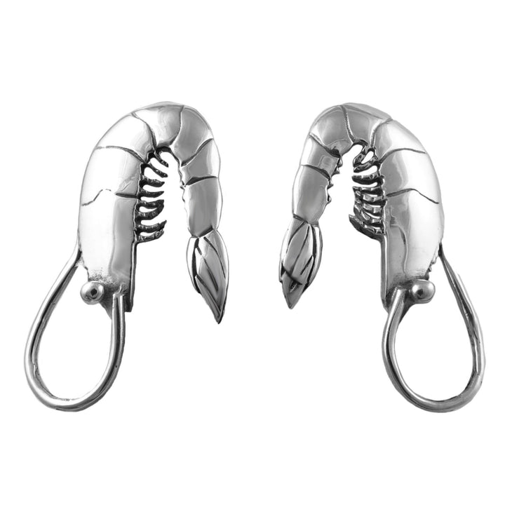 Pair of silver lobster earrings on a white background