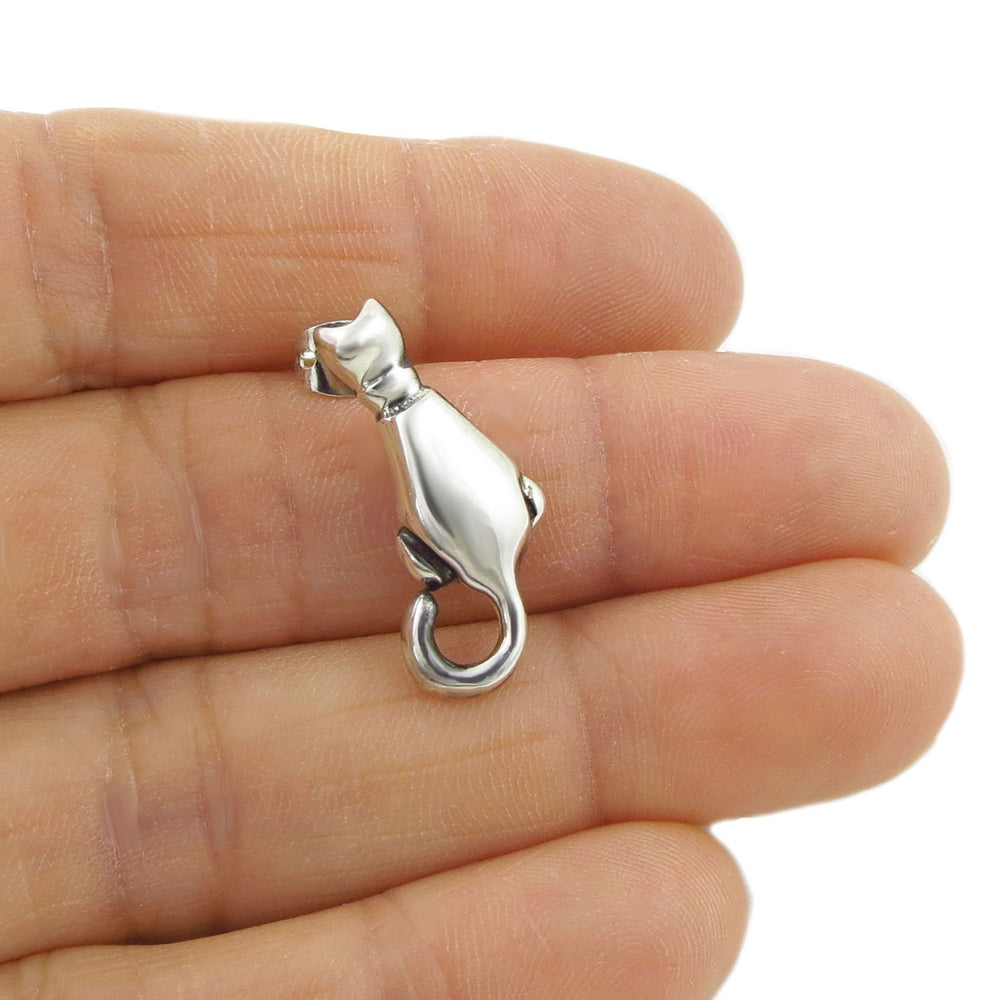 Sterling 925 Silver cat earring for women on a hand with a white background