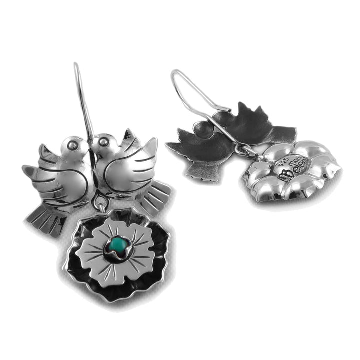 Sterling 925 silver love bird dove and flower dangle earrings with a small turquoise natural gemstone accent, shown on a plain white background.