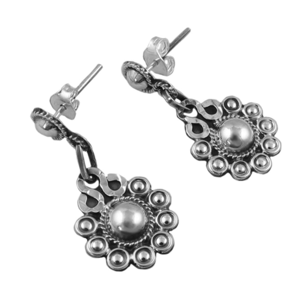 A pair of women's silver flower earrings with ornate links and a ball bead embellishment, featuring a polished and antiqued finish.