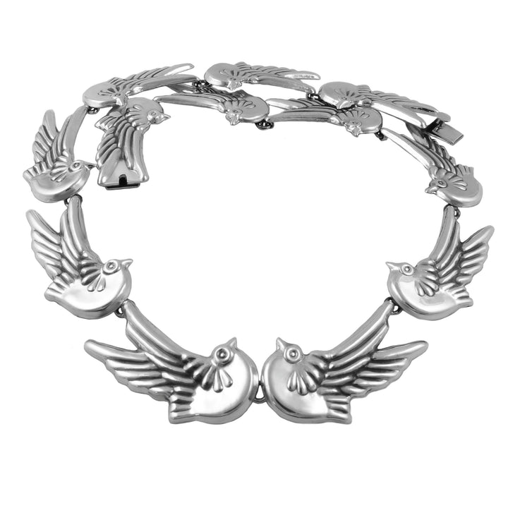 A Mexican 925 sterling silver collar necklace featuring a series of linked flying love birds, photographed against a solid white background.