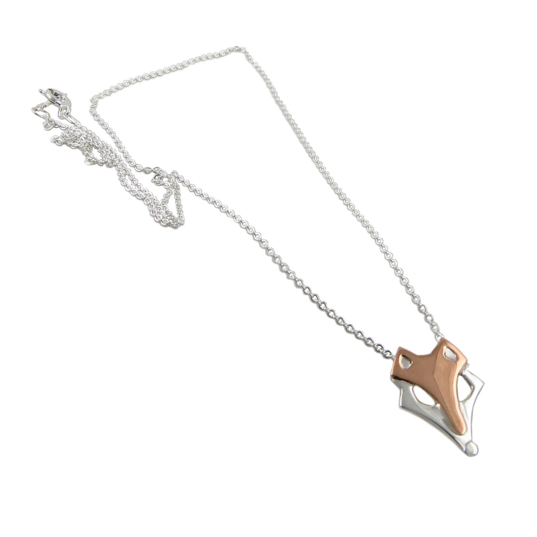 Mixed metal 925 sterling silver and copper two tone fox animal necklace with a unique pendant design on a white background