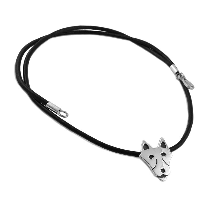 A black leather cord necklace featuring a polished 925 sterling silver wolf head pendant, displayed on a clean white background.