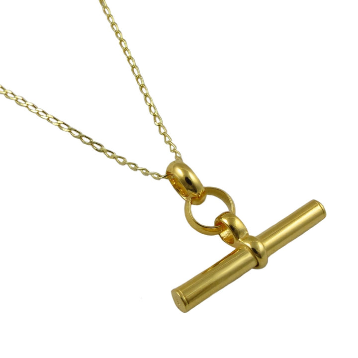 Yellow gold t-bar pendant and curb chain necklace on a white background
