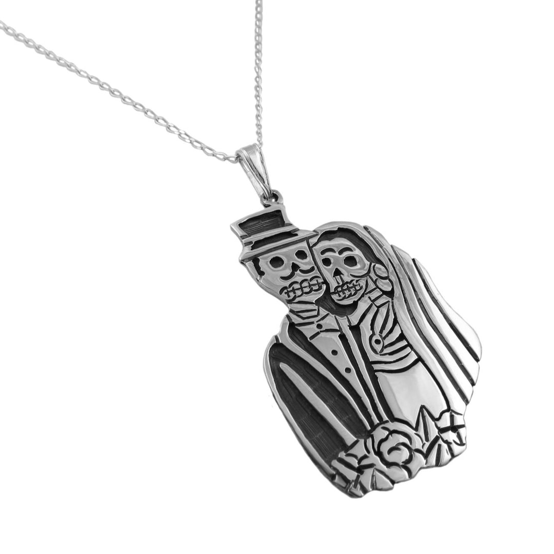 Sterling 925 Silver Mexican day of the dead pendant and chain necklace with skeleton design bride and groome on a white background