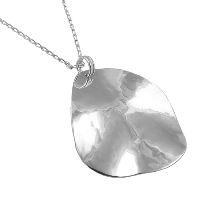 A large hammered 925 silver necklace with a textured sculpted pendant on a white background