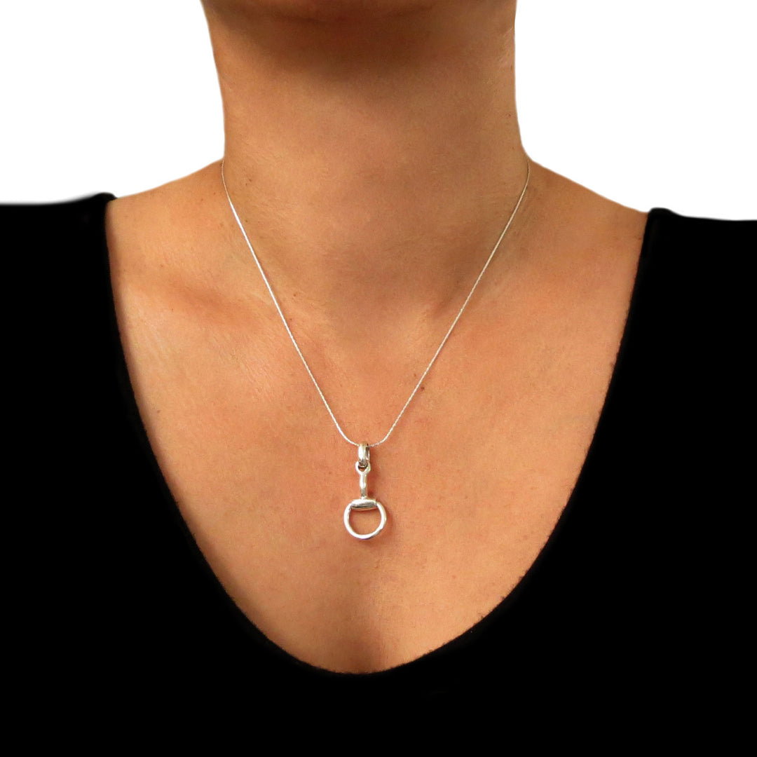 Equestrian sterling 925 Silver snaffle necklace on a woman wearing a black top.