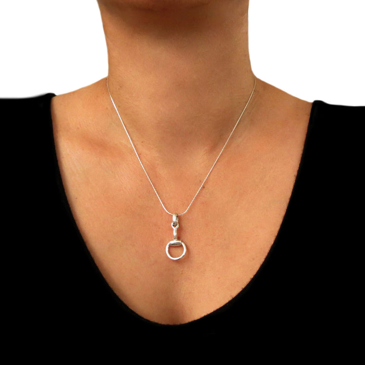 Equestrian sterling 925 Silver snaffle necklace on a woman wearing a black top.