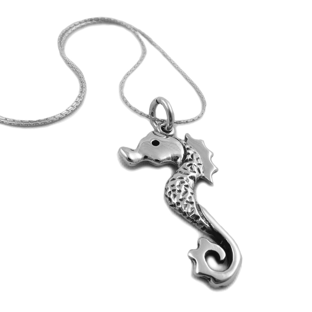 925 sterling silver seahorse pendant jewellery on a chain against a white background