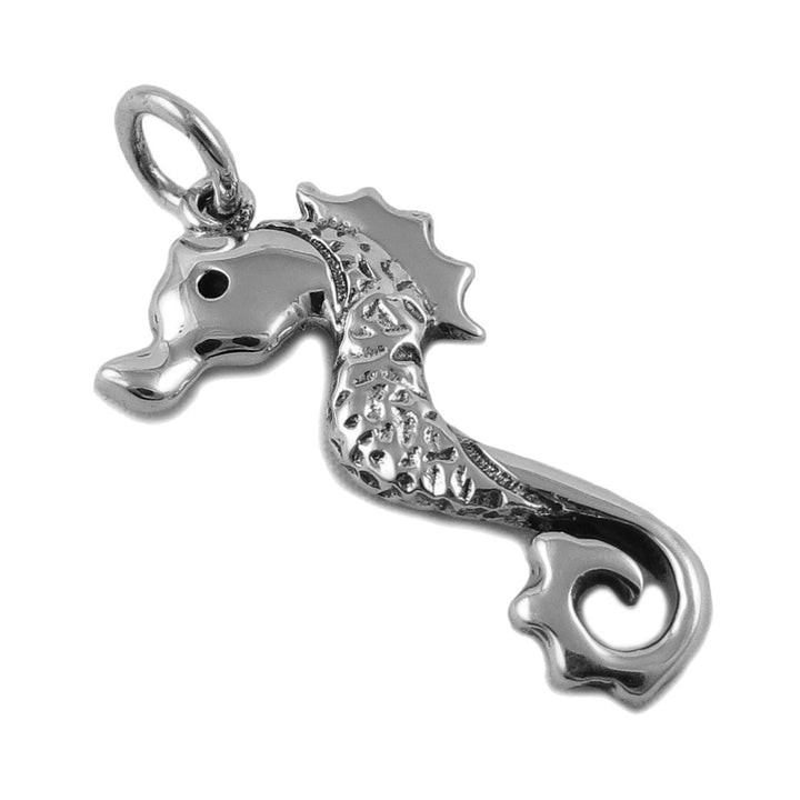 Hand cast sterling 925 silver seahorse pendant jewellery on a white background