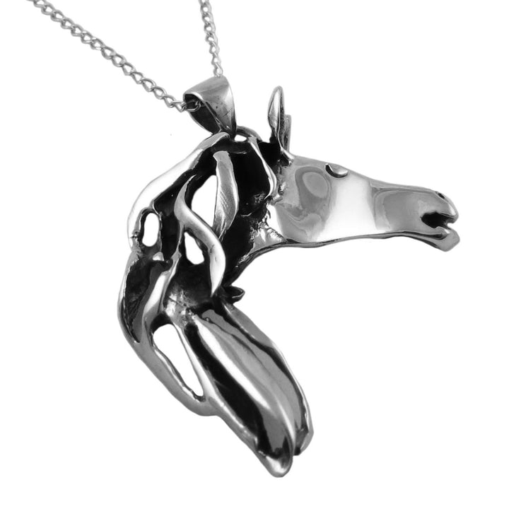 Women's sterling 925 silver horse head pendant jewellery on a chain against a white background
