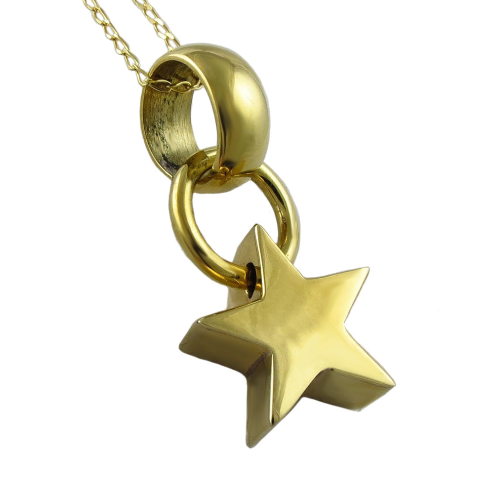 Gold star pendant on a chain against a white background