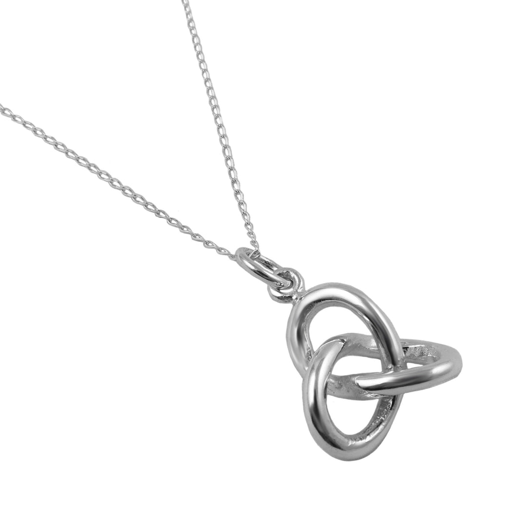 Silver necklace with a Celtic knot pendant on a white background