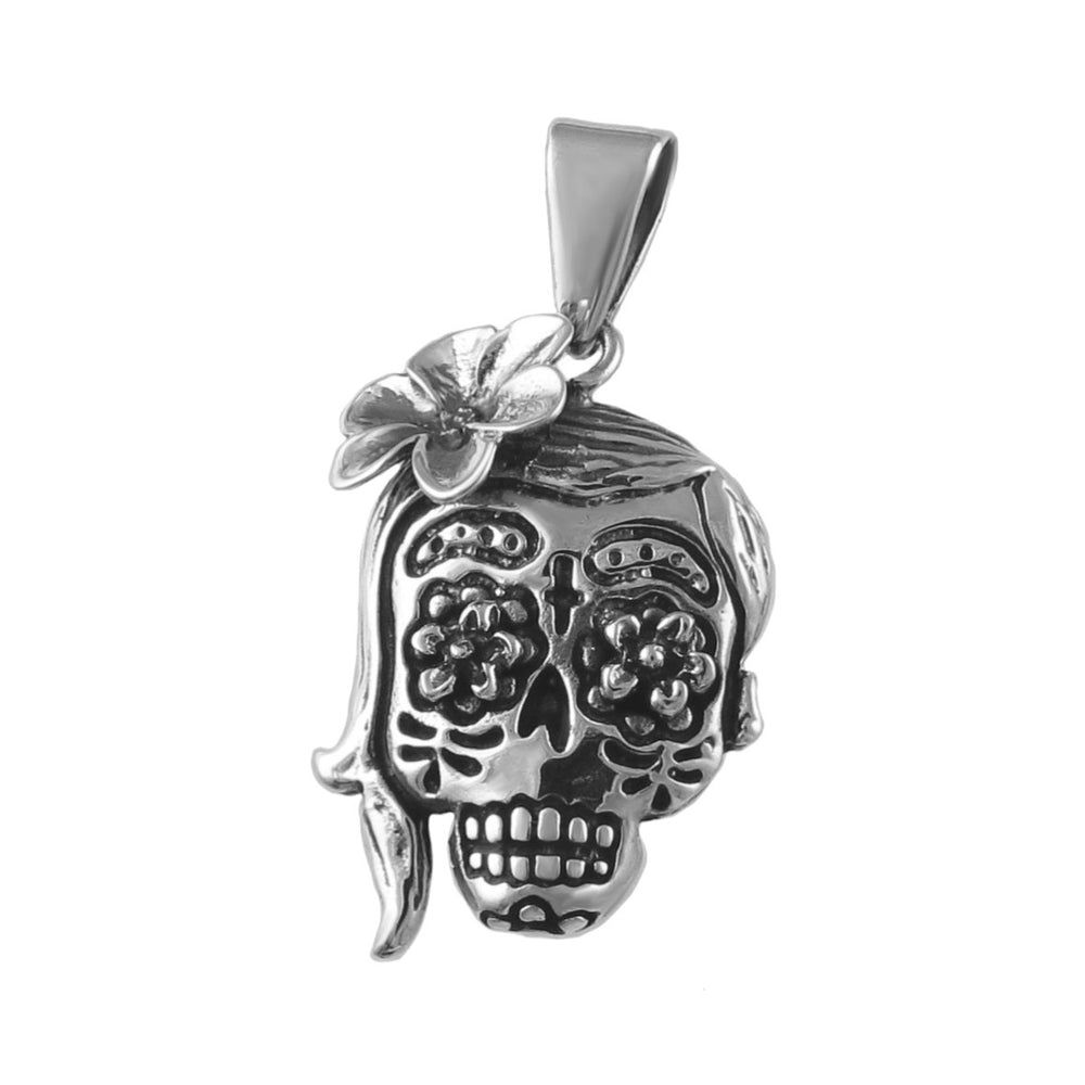 A sterling silver pendant necklace featuring a stylized skull with floral patterns and a large flower in the hair, representative of the Mexican Day of the Dead tradition.