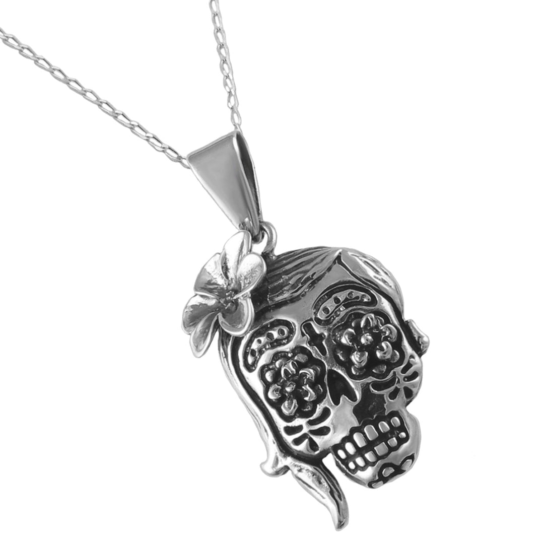 A UK hallmarked sterling 925 silver sugar skull pendant necklace with a flower detail, shown on a curb chain against a clean white background.