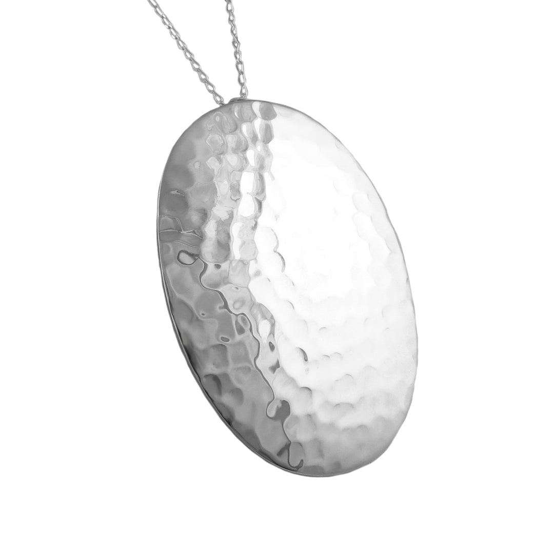 Handmade UK sterling 925 silver pendant with a textured surface on a white background