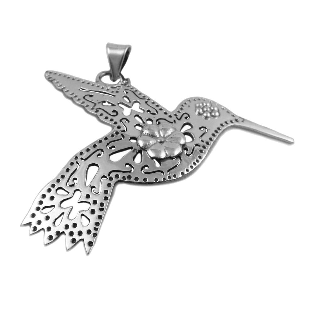 A sterling silver pendant in the shape of a hummingbird with intricate cut-out patterns.