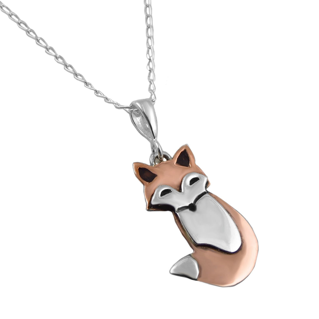 A mixed metal 925 ssilver and copper two tone fox animal pendant and chain necklace on a white background. 