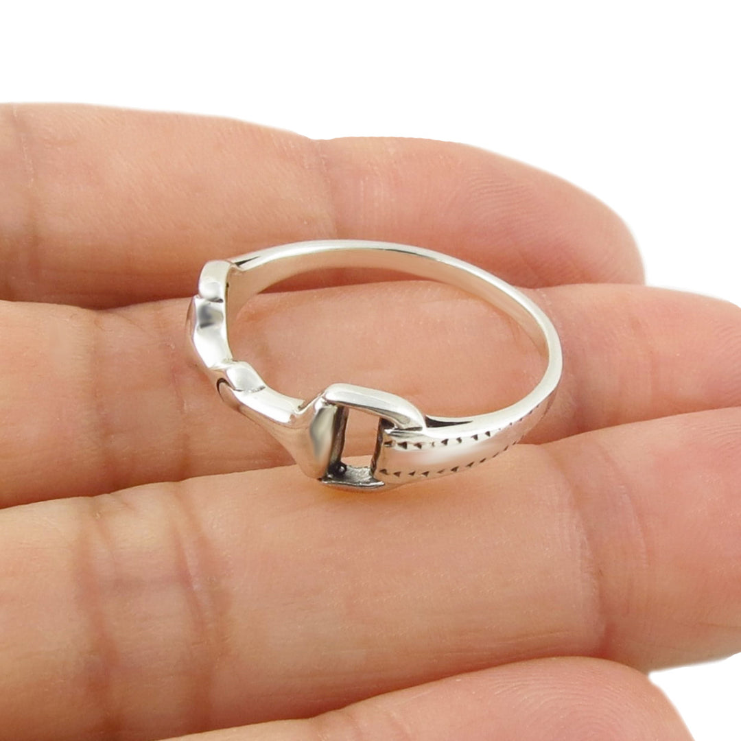 Equestrian horse snafflebit ring in 925 sterling silver held in a person's hand