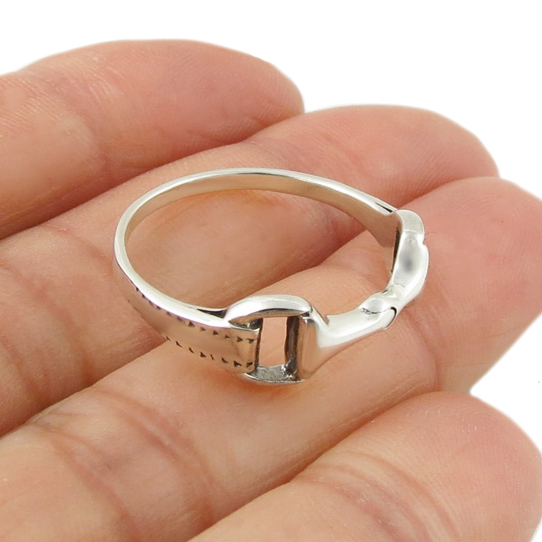 Horsebit snaffle ring in solid 925 sterling silver held in a person's hand