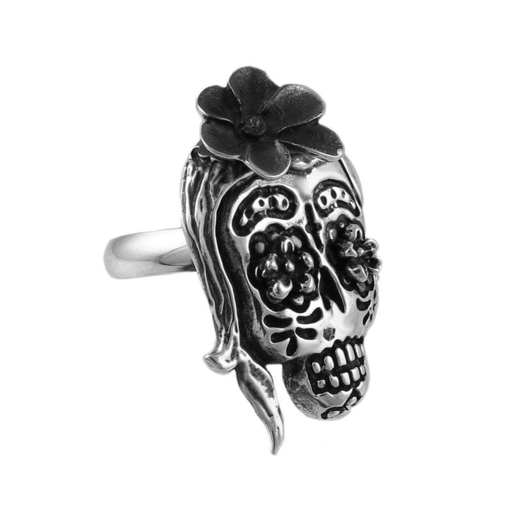 Large calavera catrina sugar skull sterling silver Mexican day of the dead  ring with black flower on a white background