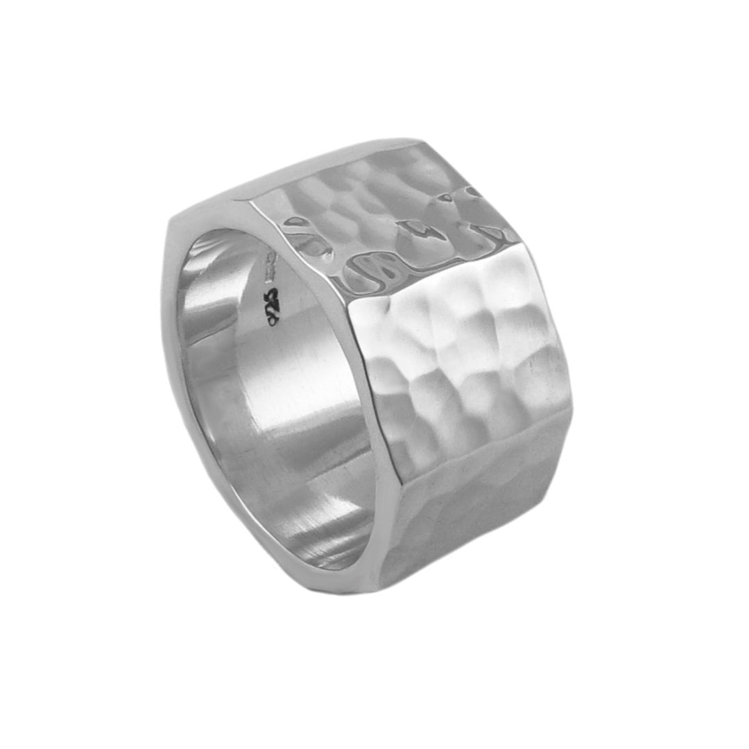 Silver ring with a textured hammered surface on a white background