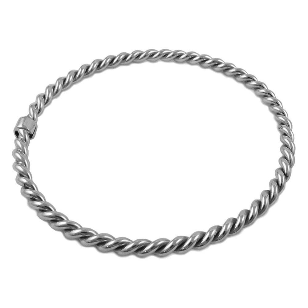 A large UK hallmarked sterling 925 silver twisted rope circle bangle for women on a white background