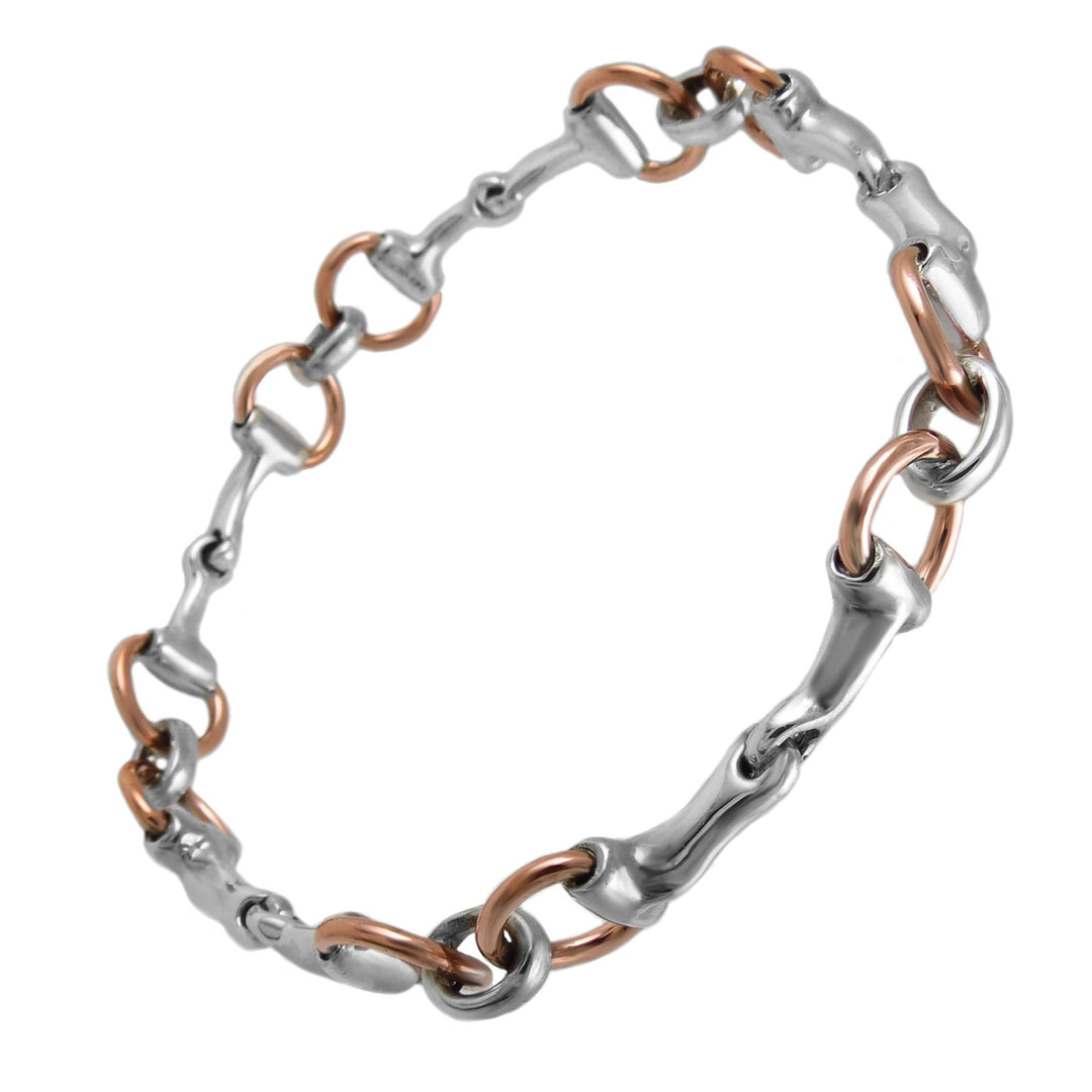 Unusual 925 silver and copper two tone horse snafflebit circle bangle on a white background