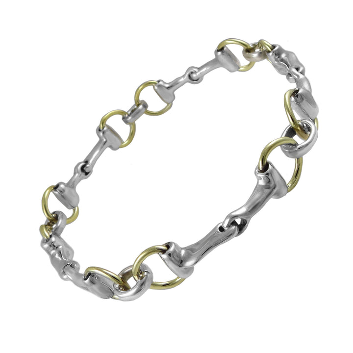 Two-tone sterling silver and gold horsebit snaffle bracelet bangle for women on a white background