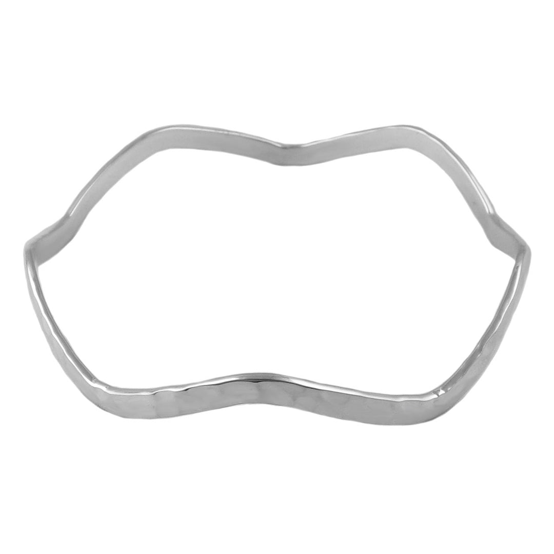 Sterling silver wavy bangle on a white background