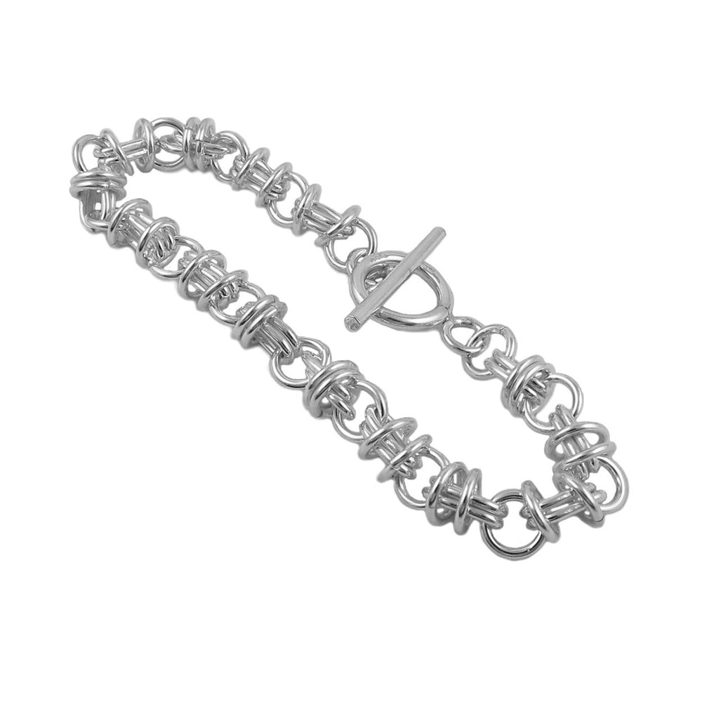 A chunky sterling silver chain bracelet with a toggle clasp, featuring a pattern of oval and circle links.