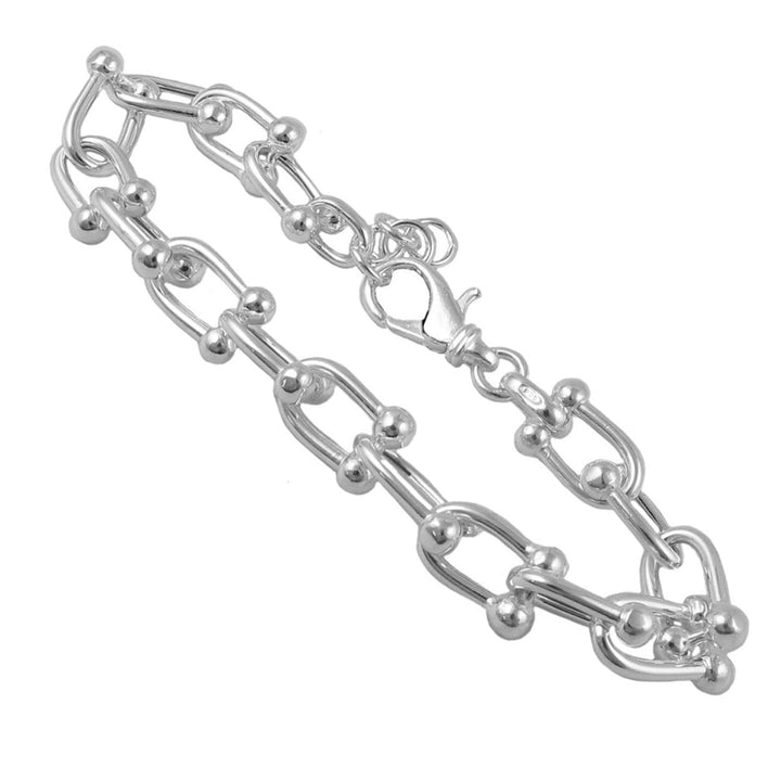 Silver gauge link chain bracelet on a white background
