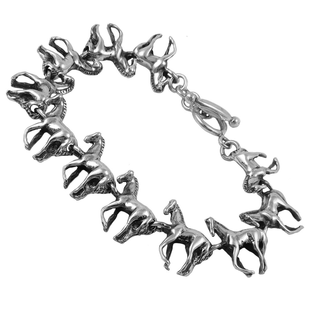 Silver bracelet with horse-shaped  links on a white background