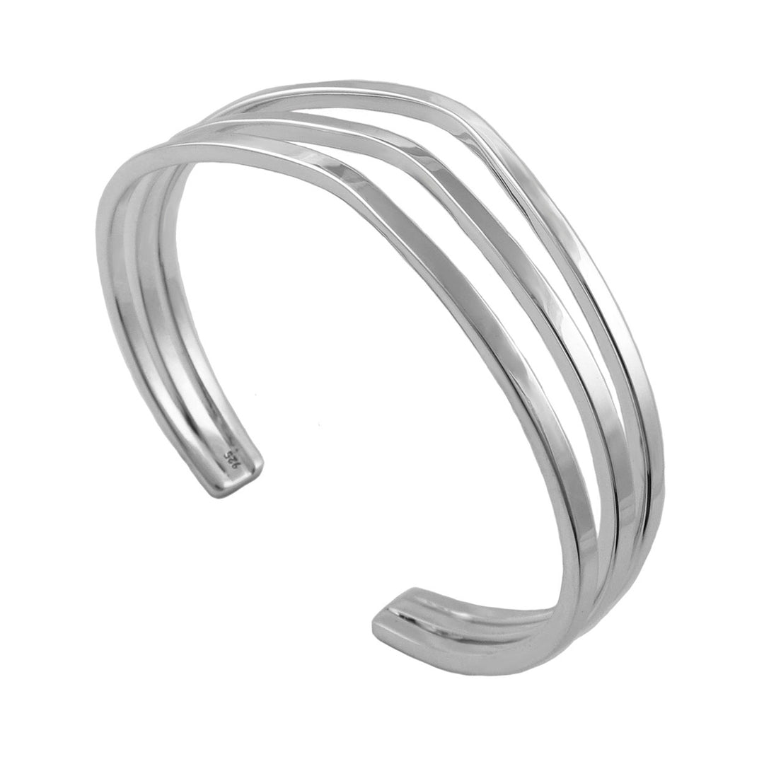UK hallmark Sterling 925 Silver bracelet with three curved bands on a white background