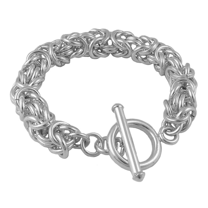 Chunky sterling 925 Silver byzantine chain bracelet with a toggle clasp on a white background